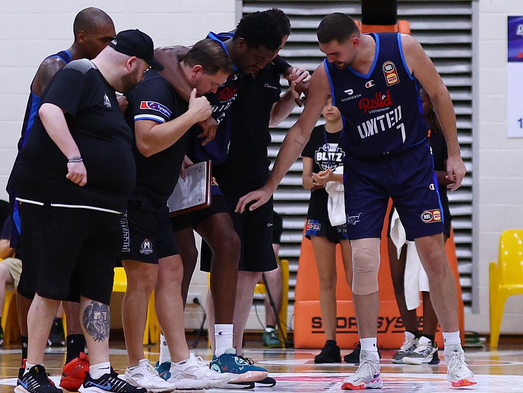 Humphries was right with teammate Ariel Hukporti as he was helped from the court in Darwin. Picture: Getty Images