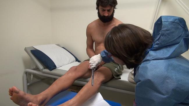 John Peros gives hair samples to police in Brisbane after his arrest. Source: Shandee’s Story.