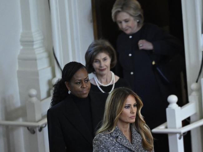 TOPSHOT - Former US Secretary of State Hillary Clinton, former US First Lady Laura Bush, former US First Lady Michelle Obama, and former US First Lady Melania Trump arrive for a tribute service for former US First Lady Rosalynn Carter, at Glenn Memorial Church in Atlanta, Georgia, on November 28, 2023. Carter died on November 19, aged 96, just two days after joining her husband in hospice care at their house in Plains. (Photo by ANDREW CABALLERO-REYNOLDS / AFP)