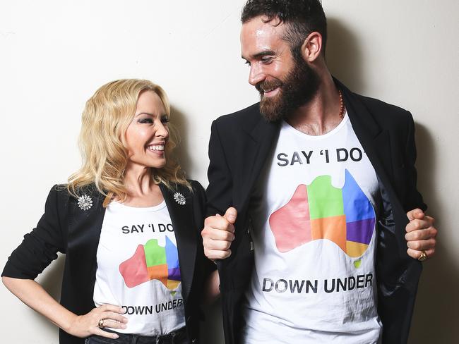 Kylie Minogue and fiance Joshua Sasse with their ‘Say ‘I do’ Down Under’ T-shirts. Picture: Dylan Robinson