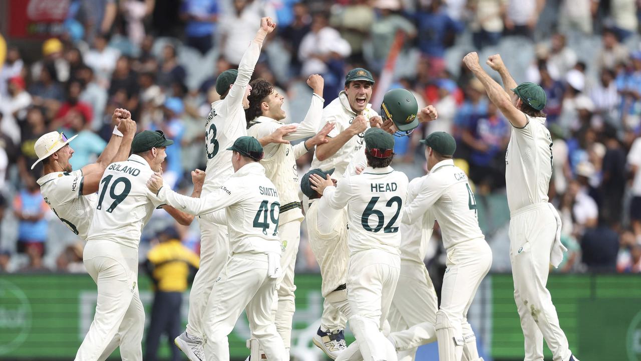 Australian players celebrate the final wicket on day five of the fourth cricket Test match. Photo by Martin Keep.