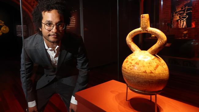 Sydney university archeologist Jacob Bongers with a sacrifice ceremony and presentation cup at the Machu Picchu and the Golden Empires of Peru exhibition. Picture: John Feder/The Australian.