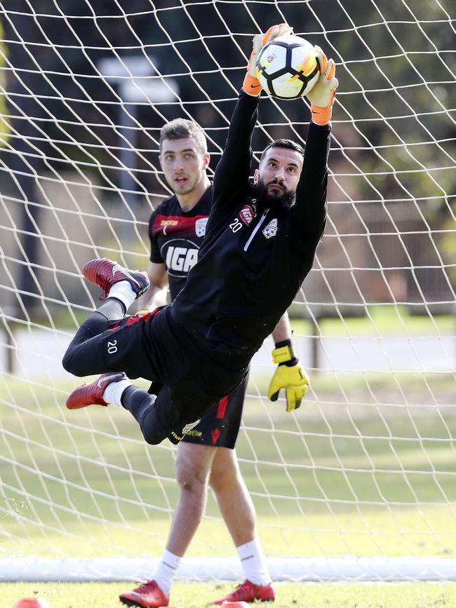 Goalkeeper Paul Izzo is put through his paces at Adelaide United training. Picture: Sarah Reed