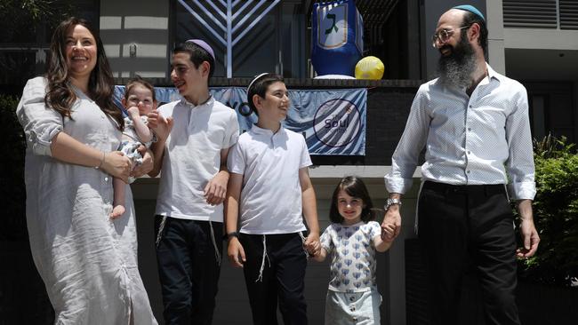 Rabbi Aycee Abrahams, his wife Sorella and their children, from left, Shayna, 13 months, Michi, 13, Eli, 11 and Rachey, 4, at their Sydney home. Picture: Jane Dempster