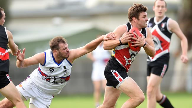 Bonbeach’s Gary Carpenter bursts through a tackle. Picture: Chris Eastman