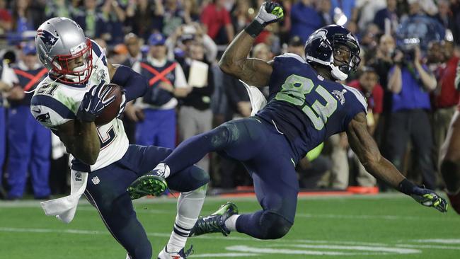 New England Patriots strong safety Malcolm Butler intercepts a pass intended for Seattle Seahawks wide receiver Ricardo Lockette during the second half of NFL Super Bowl XLIX.