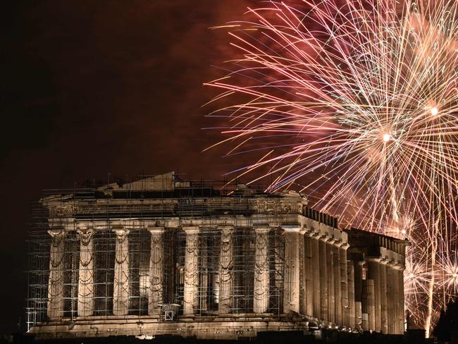 Fireworks explode over the Acropolis during New Year celebrations in Athens. Picture: AFP