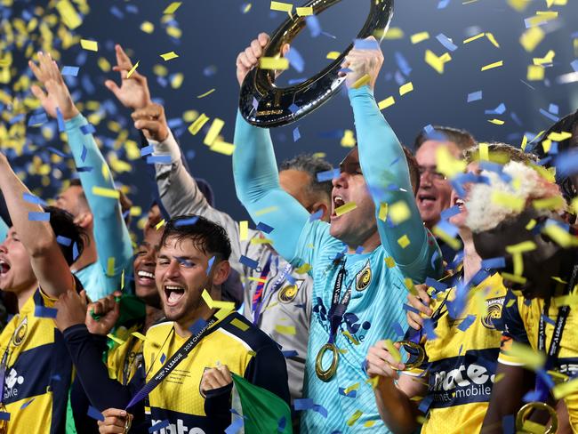 GOSFORD, AUSTRALIA - MAY 25: Danny Vukovic of the Central Coast Mariners holds aloft the Championship Trophy alongside team mates after winning the A-League Men Grand Final match between Central Coast Mariners and Melbourne Victory at Industree Group Stadium on May 25, 2024, in Gosford, Australia. (Photo by Mark Metcalfe/Getty Images)