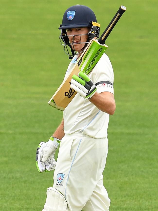 Daniel Hughes raises his bat after reaching his half century. Picture: AAP/Dave Hunt