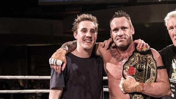 Mason Bradford (left) with father and world champion kickboxer Chris Bradford at Powerplay 40. Chris Bradford is not accused of any wrongdoing.