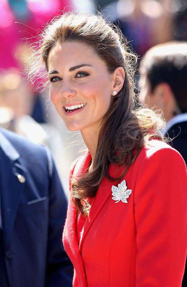 Catherine cuts a striking figure in a red Catherine Walker coat complete with maple leaf brooch at Calgary Zoo in 2011. Picture: Chris Jackson - Pool/Getty Images