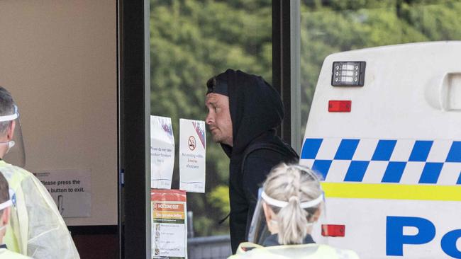 A man is transferred to the Fountainside Accomodation in Hobart. Picture Eddie Safarik