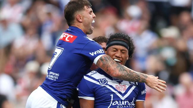 SYDNEY, AUSTRALIA - MARCH 08: Sitili Tupouniua of the Bulldogs celebrates with team mate Toby Sexton of the Bulldogs after scoring a try during the round one NRL match between St George Illawarra Dragons and Canterbury Bulldogs at Netstrata Jubilee Stadium, on March 08, 2025, in Sydney, Australia. (Photo by Mark Metcalfe/Getty Images)