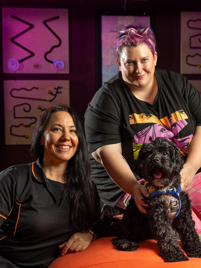 Royal Adelaide Show Carers room. Kate Quinn (Carer), Anneliese Thompson and her dog Neko the Cavoodle, emotional support dog. Picture: Sarah Reed Photography