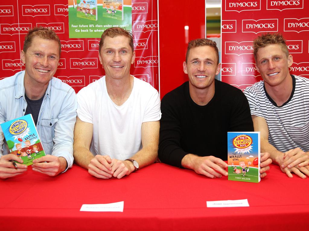 Troy with brothers Adam, Joel and Scott at the launch of their kids book in 2016. Picture: Alison Wynd