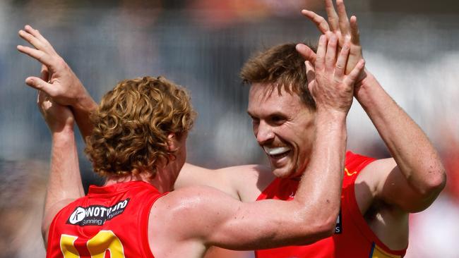 ADELAIDE, AUSTRALIA - APRIL 07: Matt Rowell of the Suns celebrates a goal with teammate Noah Anderson during the 2024 AFL Round 04 match between the Gold Coast SUNS and GWS GIANTS at Adelaide Hills - Mt Barker on April 07, 2024 in Adelaide, Australia. (Photo by Dylan Burns/AFL Photos via Getty Images)