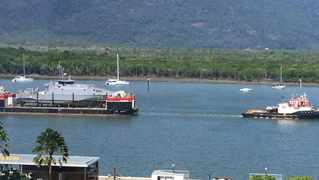 The tug PT Monto tows a barge up Trinity Inlet carrying the Nafanua II after the Guardian-class patrol boat ran aground off Samoa on August 4 last year.