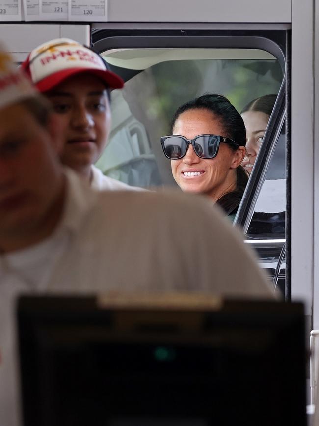 Meghan drove her $140,000 Range Rover to put in her order. Picture: BACKGRID