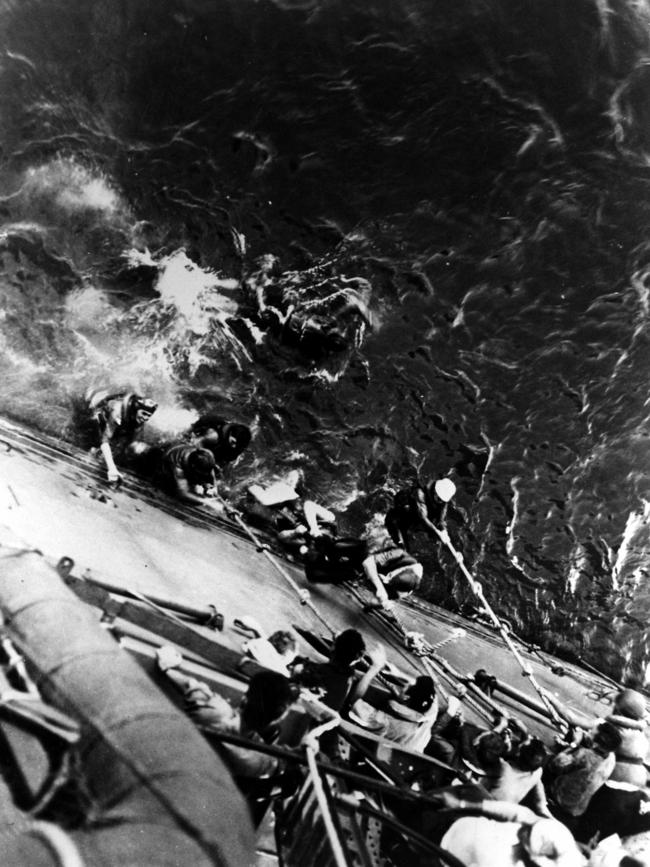 Survivors from the USS Lexington are pulled aboard US navy cruiser USS Minneapolis.