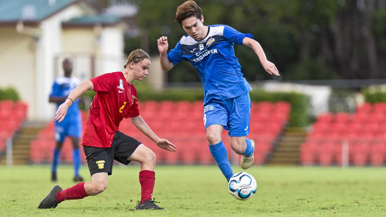 UNDER PRESSURE: South West Queensland Thunder midfielder Shota Aizawa skips around Sunshine Coast player Harrisson Bowen's tackle in their NPL QLD match at the weekend. Picture: Kevin Farmer