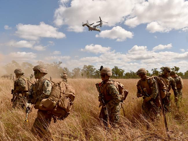 US Marines in conjunction with Australian soldiers from Battle Group Eagle comprising of elements of 3rd Brigade conduct an urban clearance of a fictitious invading force at the Townsville Filed Training Area. A US Marine V-22 Osprey lands marines. Picture: Evan Morgan