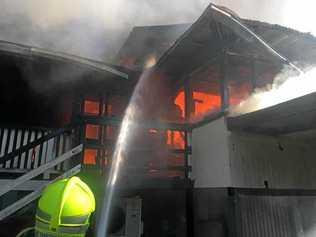 Firefighters extinguish a ferocious blaze which tore through a home in Murwillumbah on Friday afternoon.