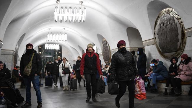 People take shelter in Vokzalna metro station in Kyiv. Picture: Daniel Leal / AFP