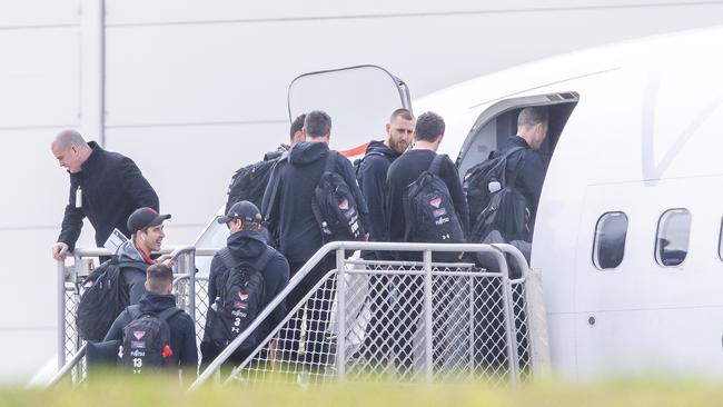 Essendon Players boarding the plane out of Melbourne. Picture: Wayne Taylor.