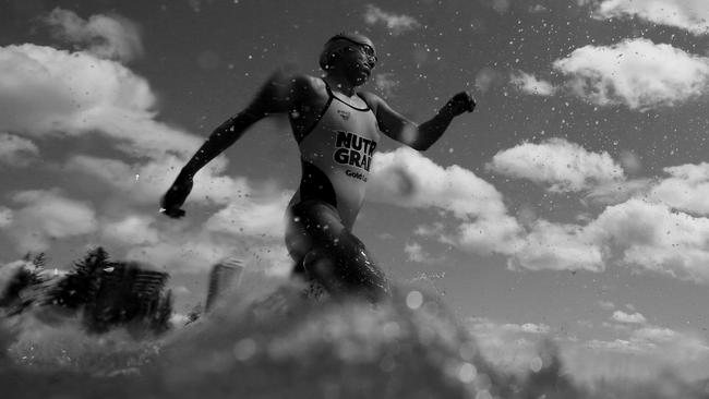 Jemma Smith racing into the water during the Coolangatta Gold.