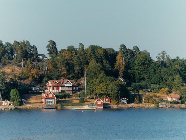 EMBARGO FOR Travel & Luxury February 17, 2023. Silver Moon's Baltic Sea, Voyage. WORDS BY Lindy Alexander. PHOTOGRAPHY BY Lauren Bamford. Swedish clapboard houses outside Stockholm.