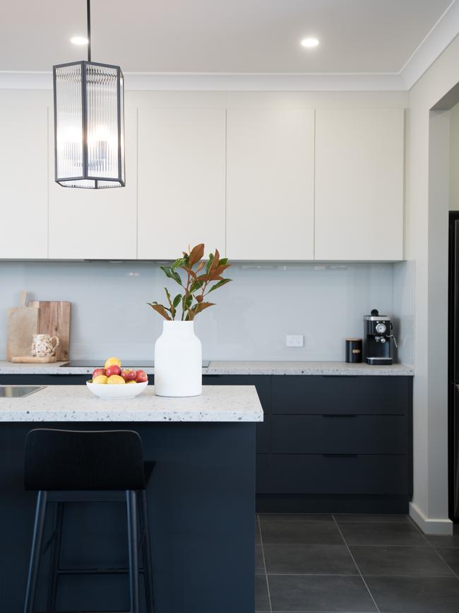 A black island and lower cabinetry in Hickinbotham’s Chesterfield display at Playford Alive.