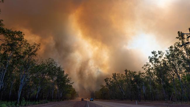 The Arnhem Highway was closed for several hours on Monday as fire came close to the highway and made driving dangerous. Picture: Che Chorley