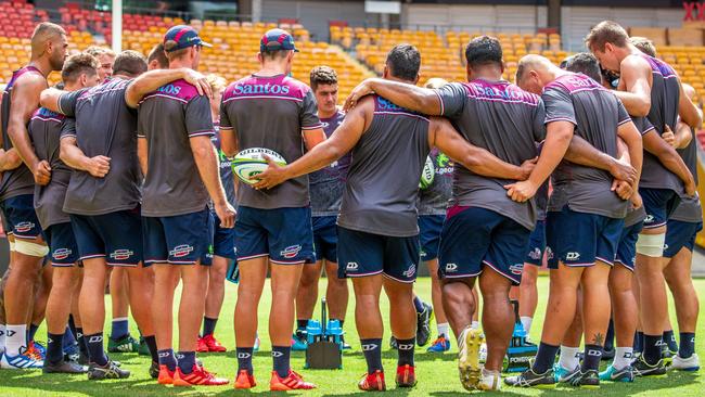 The Queensland Reds bond in the middle of Suncorp Stadium after final training before the clash against the Sunwolves