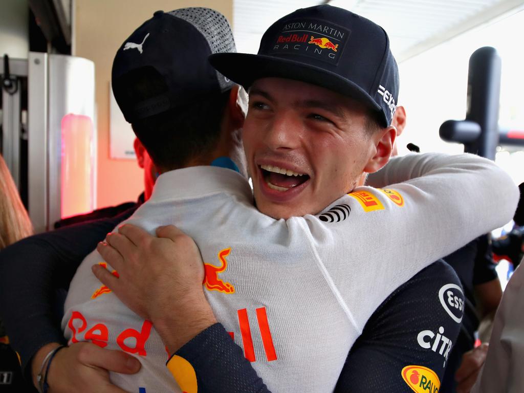 Max Verstappen hugs Daniel Ricciardo before their final race both in Red Bull colours.