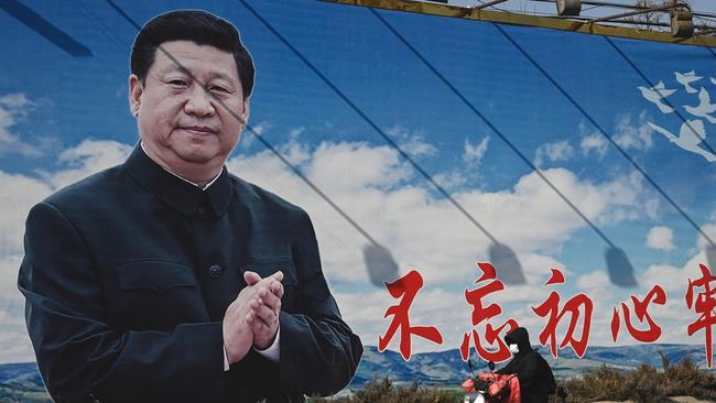 A giant image of Xi Jinping looms over a Beijing street. Picture: AFP