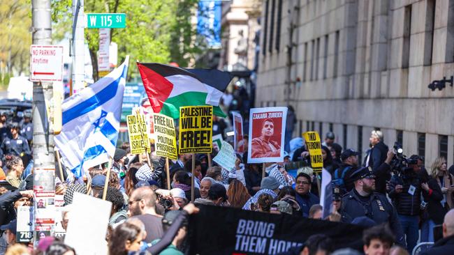 Pro-Palestine and pro-Israel protesters face off in front of the entrance of Columbia University which is occupied by pro-Palestine protesters in New York. Picture: AFP