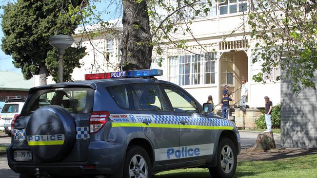 Police at Flint House, a men's shelter in Pirie Street, New Town.