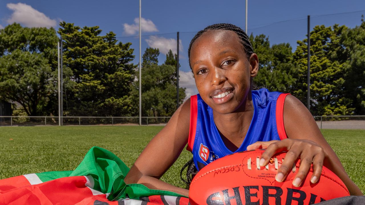 AFLW draft prospect Elaine Grigg with the Kenyan flag. Picture: Ben Clark