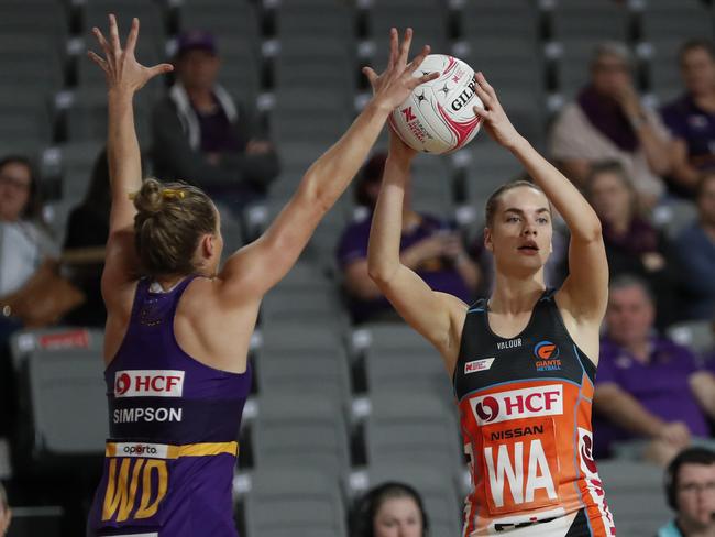 Firebirds captain Gabi Simpson (left) battles the Giants’ Kiera Austin during the 61-61 draw. Picture: Regi Varghese/Getty Images