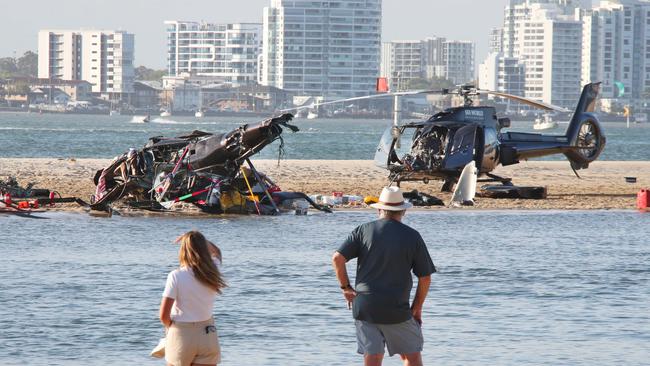 The devastating scene after a mid-air helicopter collision between two SeaWorld Helicopters just outside the Sea World tourist park on a sandbank in the Southport Broadwater. Picture: Glenn Hampson