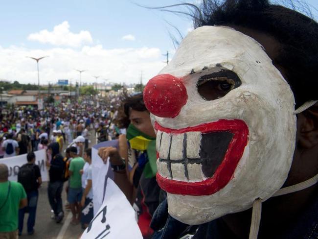 Protesters demonstrate as a group clashes with riot police while trying to block access to the Castelao Stadium in Fortaleza.