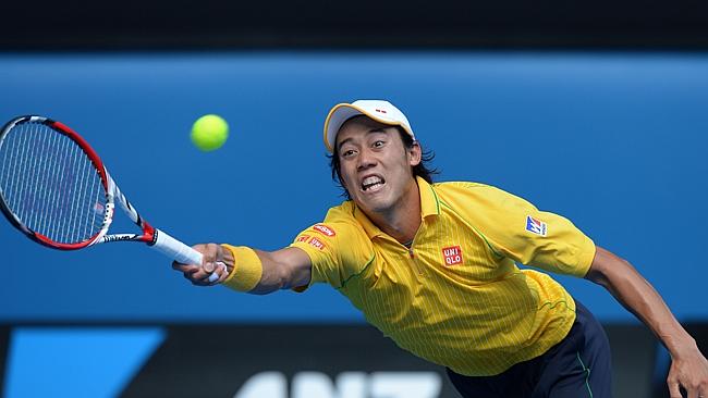 Japan's Kei Nishikori plays a shot against Spain's Rafael Nadal.