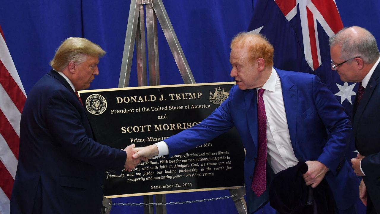Donald Trump shakes Anthony Pratt’s hand as former Australian prime minister Scott Morrison looks on at a Pratt Industries plant opening in Ohio. Picture: Saul Loeb/AFP