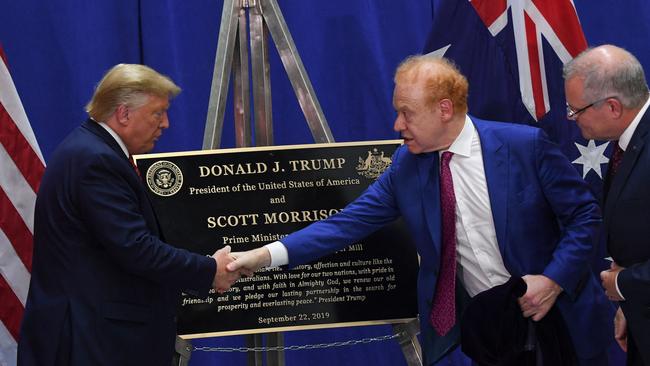 Donald Trump shakes Anthony Pratt’s hand as former Australian prime minister Scott Morrison looks on at a Pratt Industries plant opening in Ohio. Picture: Saul Loeb/AFP