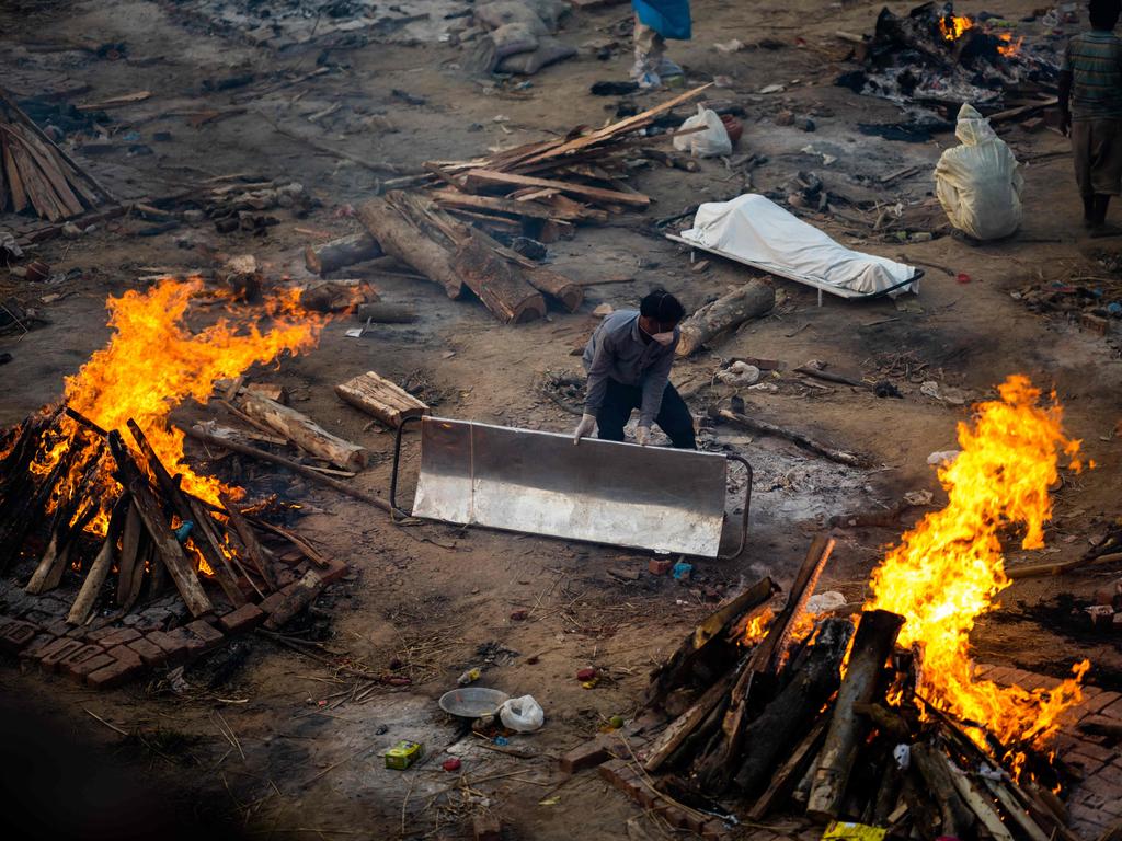 A man carries a stretcher at a cremation ground in New Delhi. Picture: Jewel Samad/AFP