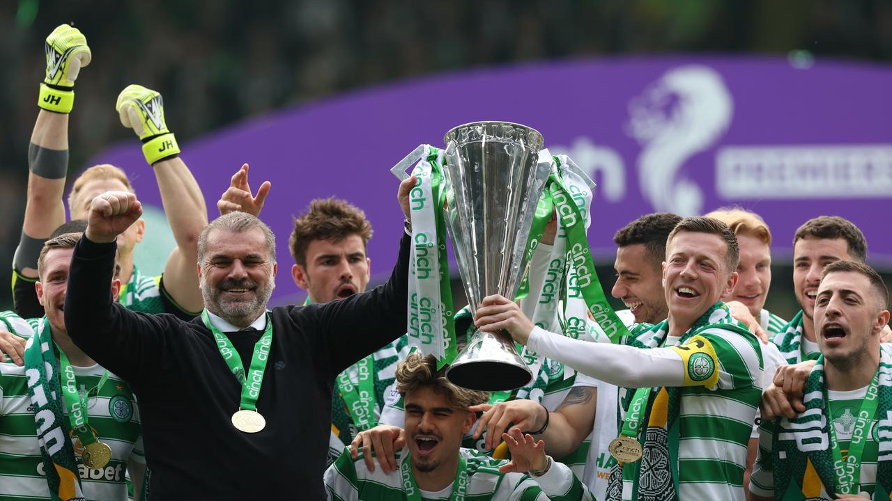 Celtic manager Ange Postecoglou (left) lifts the Scottish Premiership trophy with Hoops captain Callum McGregor. Picture: Ian MacNicol/Getty Images