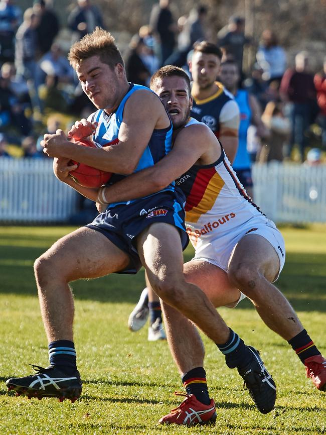 Sturt's Josh Dodd is tackled by Adelaide's Lachlan Murphy. Picture: AAP Image