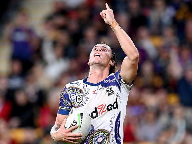 BRISBANE, AUSTRALIA - MAY 27: Nicho Hynes of the Storm celebrates scoring a try during the round 12 NRL match between the Brisbane Broncos and the Melbourne Storm at Suncorp Stadium, on May 27, 2021, in Brisbane, Australia. (Photo by Bradley Kanaris/Getty Images)