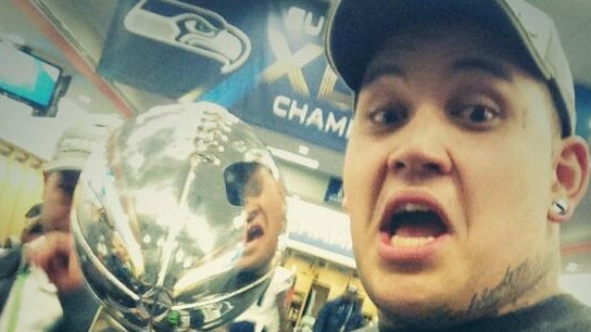 Australia's Jesse Williams pictured with the Vince Lombardi Trophy after Seattle's win over Denver in 2014.