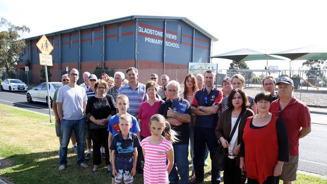 Frank Rivoli is among the Hume residents concerned over a third runway at Melbourne Airport, with the proposed flight path over their homes. Frank and and a group of residences in front of Gladstone Views Primary School which is over the flight path. Picture: Brendan Francis.